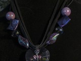 Violet Swarovski Crystal Necklace
Hearts & Dragonflies Collection
3-strand black suede lace leather
Eclectic mix of beads
Antique Pewter ends
Sterling Silver Dragonfly
NSCLH1GM0000015
Available: Mill Creek Pub