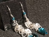 Aquamarine Swarovski & Sterling Silver
Sterling fishhook earwires
Aquamarine Swarovski Crystal Hearts & beads
Silver plated clusters of hearts drop onto a Swarovski Crystal heart.
Limited Quantities
