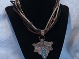 Sapphire Copper Dragonfly Necklace
Copper Dragonfly with Sapphire Swarovski Crystals
Floating on Glass Leaf
Copper colored glass beads
5-Strand Suede Lace Leather Necklace
SOLD!