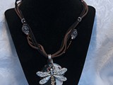 Silver Dragonfly
Floating on Black/White/Copper Glitter Leaf
Topaz & Absolute Swarovski Tail
5-Strand Suede Leather
Glass Beads
SOLD!