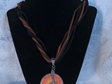 Peace on the Sun!
Leather Necklace
Guitar
Sold!